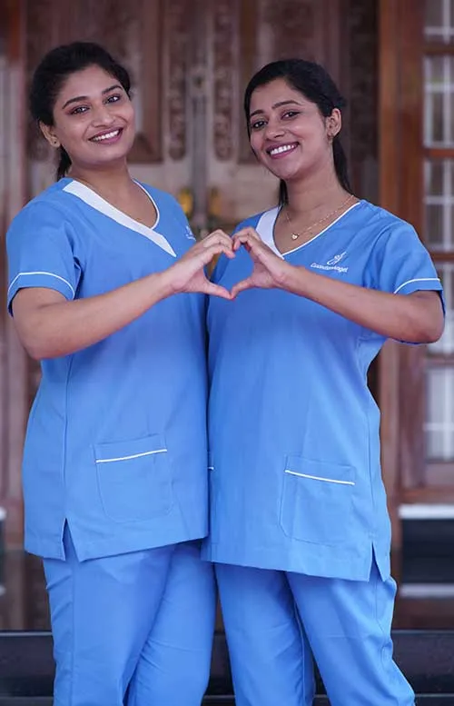 Two caregivers smiling and looking positive