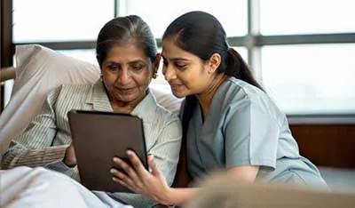 People looking at a tablet